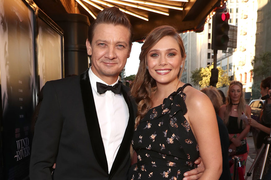 8. 1. Jeremy Renner and Elizabeth Olsen attend the premiere of The Weinstei...