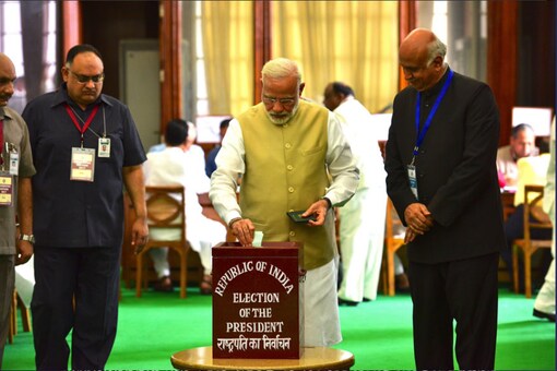Prime Minister Narendra Modi casts his vote for the presidential elections on Monday. (Image: Twitter/Narendra Modi)