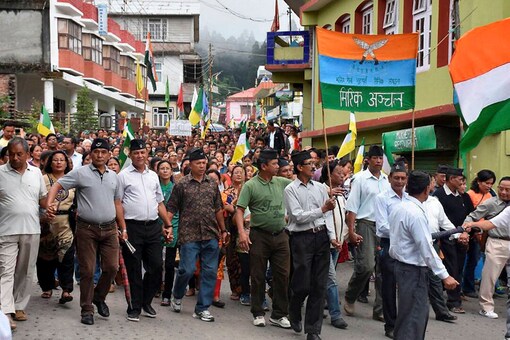 GJM supporters take out a rally to demand for separate state 'Gorkhaland' during a protest in Darjeeling. (PTI) 