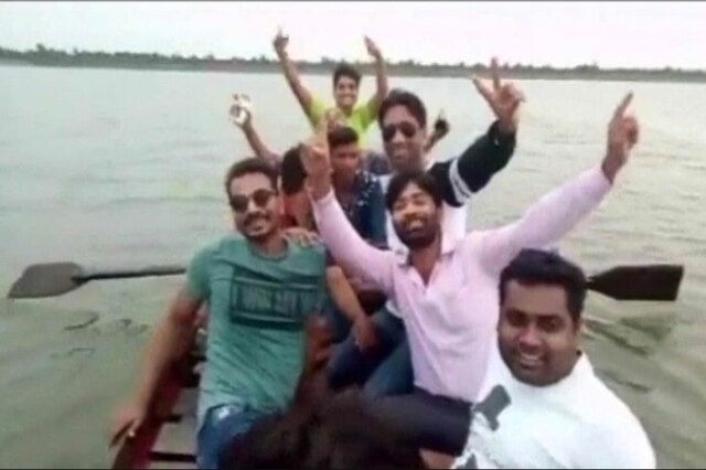 A photo of the people in the boat before the incident happened. Screengrab from CNN-News18