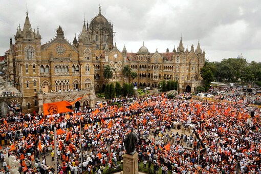File photo. Tens of thousands of people waving saffron flags are marching through Mumbai demanding quotas in government jobs and education for the Maratha community.  (Image: AP)
