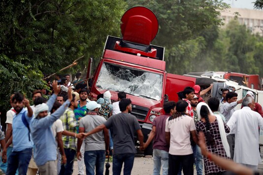 Rioters smash television trucks during violence in Panchkula. Image: Reuters Rioters smash television trucks during violence in Panchkula. Image: Reuters