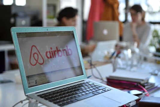 The logo of online lodging service Airbnb is displayed on a computer screen in the Airbnb offices in Paris. (Photo courtesy: AFP Relaxnews)