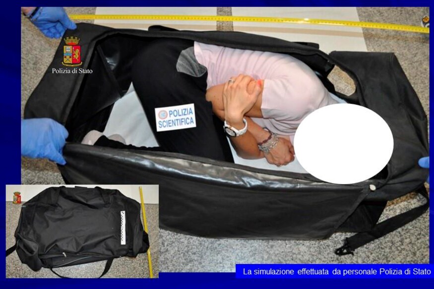 Italian police handout shows a person taking part in a reenactment by Italian police on how a kidnapped British model was kept in a bag