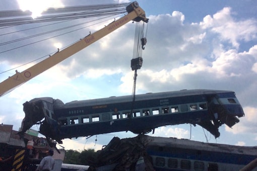 A crane lifts one of the 14 mangled coaches of the Utkal Express which derailed on Saturday evening in Uttar Pradesh's Muzaffarnagar. (Network18 photo) 