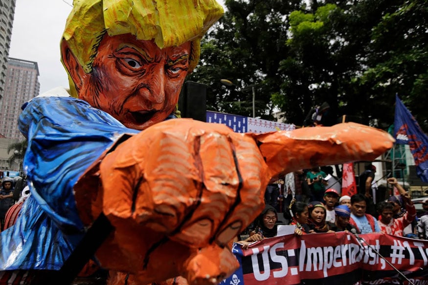 Manila: Protesters sing beside an effigy of U.S. President Donald Trump as they tried to march towards the U.S. Embassy in Manila, Philippines on Friday, Sept. 15, 2017. The group is protesting against the alleged increasing intervention of the U.S. military in the ongoing war in Marawi and growing presence in Mindanao. (Image: AP)