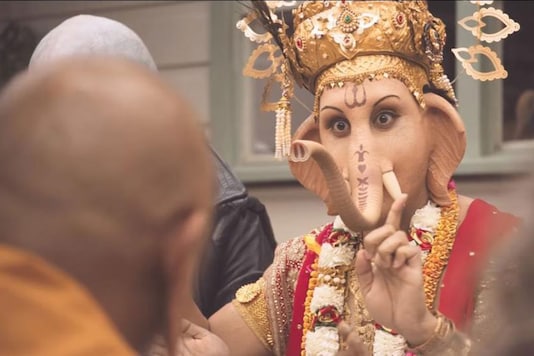 In the TV commercial, a number of religious figures, including Lord Ganesha, are seen sitting down together to a lamb-based meal and raising a glass to the meat. In the TV commercial, a number of religious figures, including Lord Ganesha, are seen sitting down together to a lamb-based meal and raising a glass to the meat.