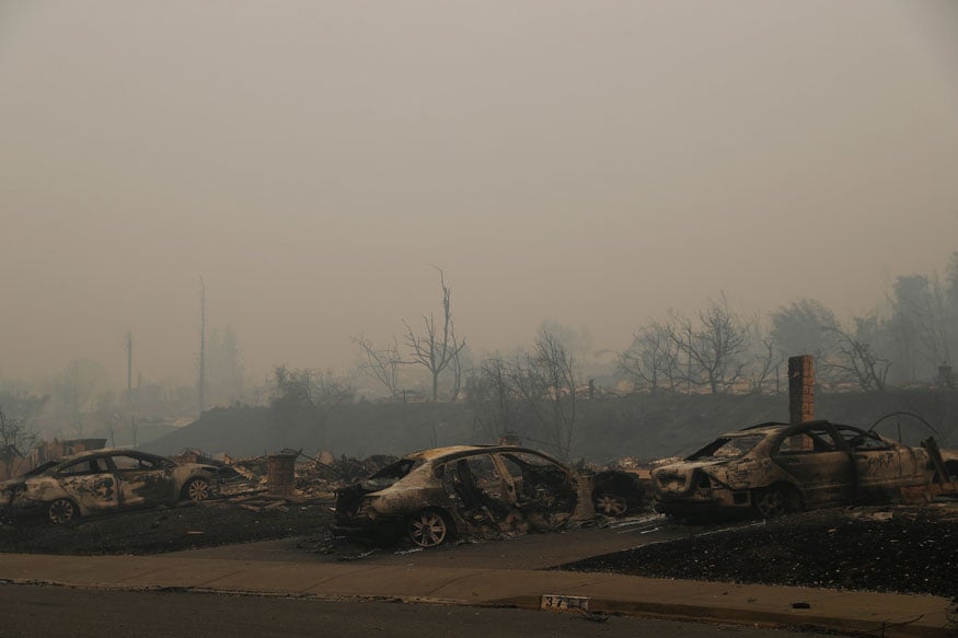 Burned out cars rest on driveways at a residential neighborhood along Fountaingrove Parkway during the Tubbs Fire in Santa Rosa, California (REUTERS)