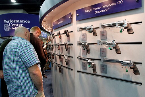 Gun enthusiasts look over Smith & Wesson guns at the National Rifle Association's (NRA) annual meetings and exhibits show in Louisville, Kentucky. (Photo: REUTERS/John Sommers II/File Photo)