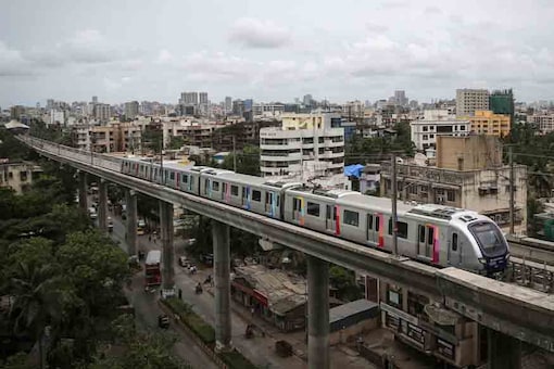A metro train travels through a residential area in Mumbai. (Image: Reuters)