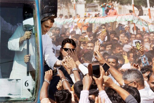 Congress vice-president Rahul Gandhi meeting supporters during a road show at Samni village of Bharuch district. (File Photo: PTI)
