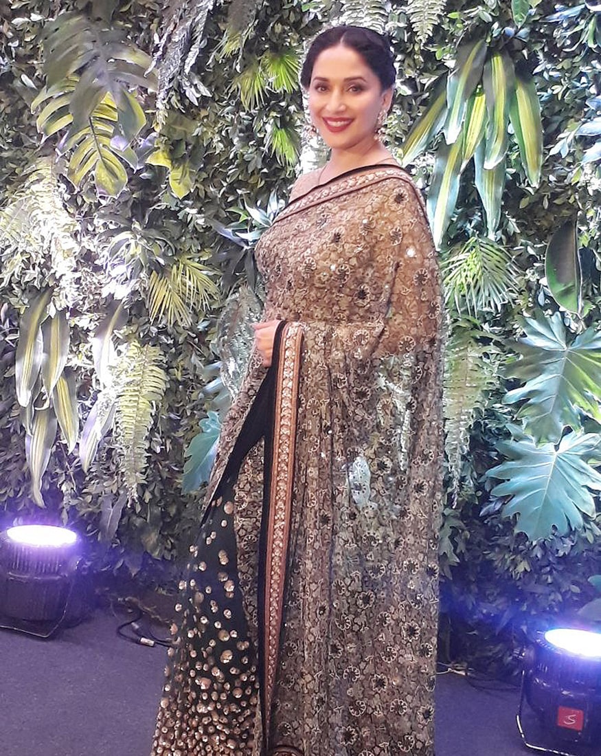 Bollywood actress Madhuri Dixit attends the wedding reception of Virat Kohli and Anushka Sharma held at St. Regis Hotel in Mumbai on December 26, 2017. (Image: Yogen Shah)