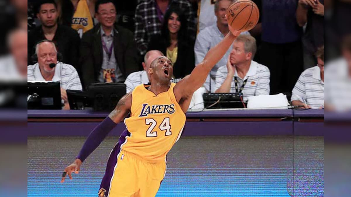Kobe Bryant of the Los Angeles Lakers pulls his jersey during the NBA  News Photo - Getty Images