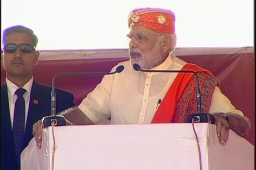 PM Narendra Modi addresses a rally for Phase 2 in Gujarat on Saturday.