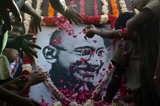 File photo of people paying homage to Mahatma Gandhi.