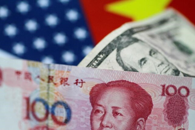 US Dollar and China Yuan notes are seen in this picture illustration. (File Photo: Reuters)