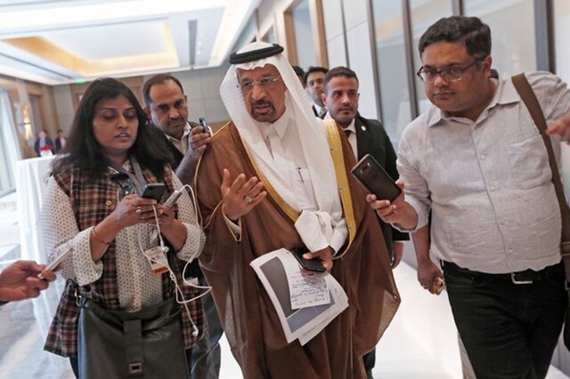 Saudi Arabia's Energy Minister Khalid al-Falih (centre) talks to the media as he leaves after a meeting in New Delhi on February 23, 2018. (Photo: Reuters/Adnan Abidi)