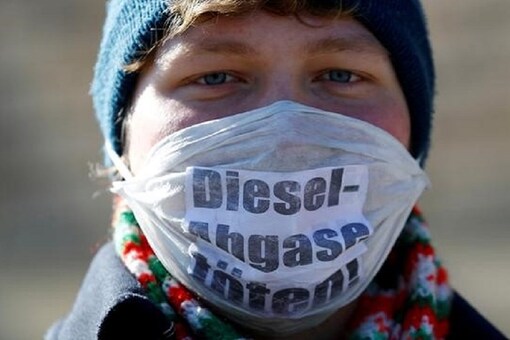 An environmental activist protests in front of Germany's federal administrative court, before they decide whether German law provides a legal basis for cities to ban diesel cars to help reduce air pollution, The words read "Diesel exhaust kills.". (Image: Reuters)