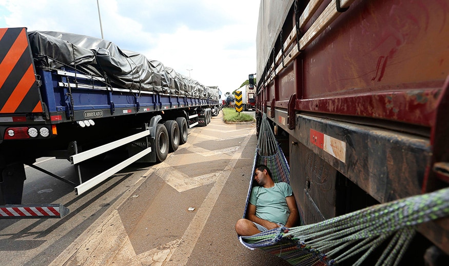 A truck driver sleeps during a truckers' protest on the BR 381 highway in Betim, Minas Gerais. (Image: Reuters)
