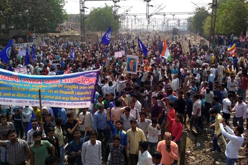 Members of Dalit community stage a protest during 'Bharat Bandh' against the alleged 'dilution' of the Scheduled Castes and the Scheduled Tribes Act by Supreme court.