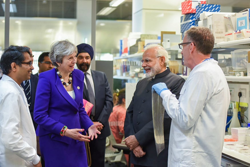 Prime Minister Narendra Modi with British Prime Minister Theresa May visits the Francis Crick Institute in London. (Image: PTI)