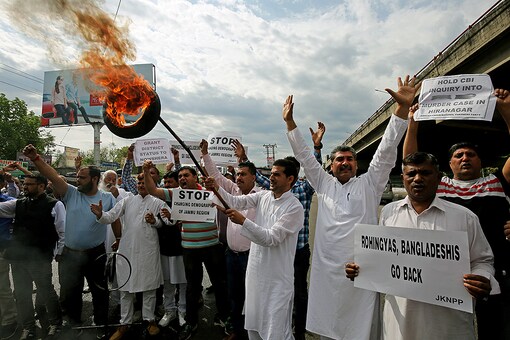 File photo: Protesters burn tires and shout slogans during a protest in Jammu supporting various demands, including deportation of Rohingya and Bangladeshi nationals from Jammu, and a CBI probe into the rape and murder of an eight-year-old girl in Kathua. (Reuters)