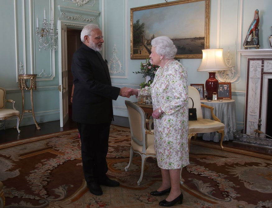 Prime Minister of India Narendra Modi is greeted by Britain's Queen Elizabeth during a private audience at Buckingham Palace, London. (Image: AP)