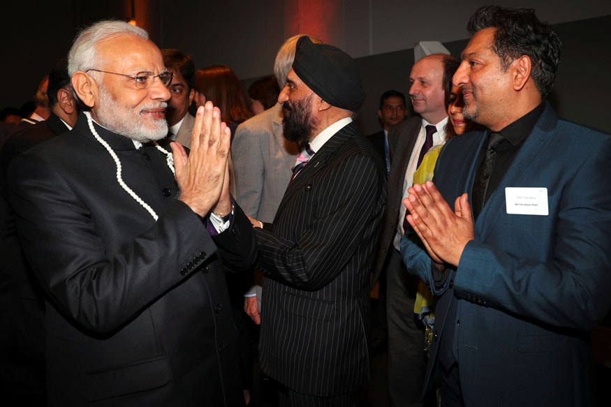 Prime Minister Narendra Modi greets British-Asian entertainers during a visit to the Science Museum in London. (Image: AP)
