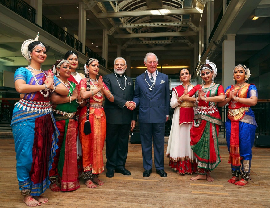 Britain's Prince Charles and India's Prime Minister Narendra Modi pose with dancers during a visit the Science Museum in London. (Image: AP)