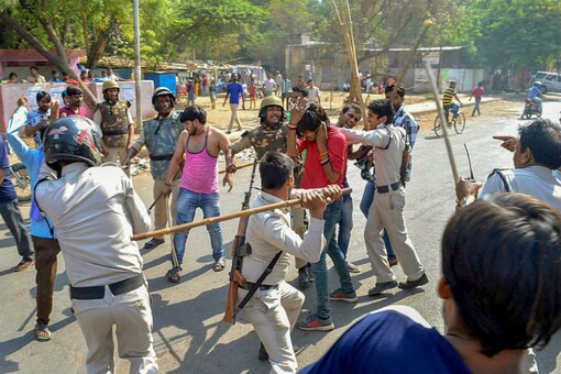 Police personnel lathi charge protesters during 'Bharat Bandh' in Gwalior on Monday. (PTI Photo)