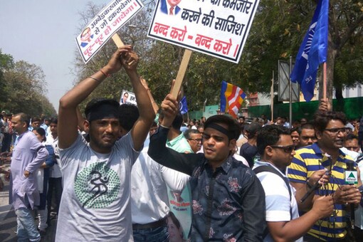 File photo: Dalit activists holding banners and raising slogans during a protest at Mandi House Circle in New Delhi. (Image: Rahul Malhotra/ News18)