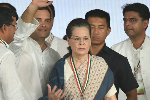 Congress President Rahul Gandhi with his mother, former party president Sonia Gandhi and other party leaders during 'Jan Akrosh Rally', in New Delhi on Sunday. (PTI Photo)