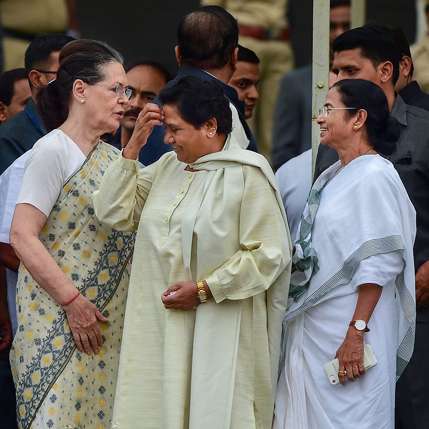 Congress leader Sonia Gandhi greets West Bengal Chief Minister Mamta Banerjee, as Bahujan Samaj Party (BSP) leader Mayawati walks past. (PTI)