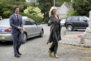 Actor Jack Donnelly arrives with partner Malin Akerman for the wedding ceremony of Game Of Thrones actors Kit Harington and Rose Leslie, at Rayne Church, Kirkton of Rayne in Aberdeenshire, Scotland, Saturday June 23, 2018. Former "Game of Thrones" co-stars Kit Harington and Rose Leslie are marrying Saturday with a celebration at the bride's family castle in Scotland. The couple and guests arrived at Rayne Church, close to the 900-year-old Wardhill Castle in northeast Scotland, which is owned by Leslie’s family. (Jane Barlow/PA via AP)