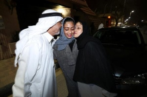 Hannan Iskandar is kissed by her parents, after she drove her car in her neighborhood, in Al Khobar