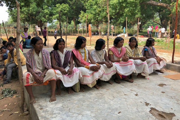 Members of the Dongria Kondh tribe attend a protest demanding the ouster of a Vedanta Limited alumina plant in Lanjigarh