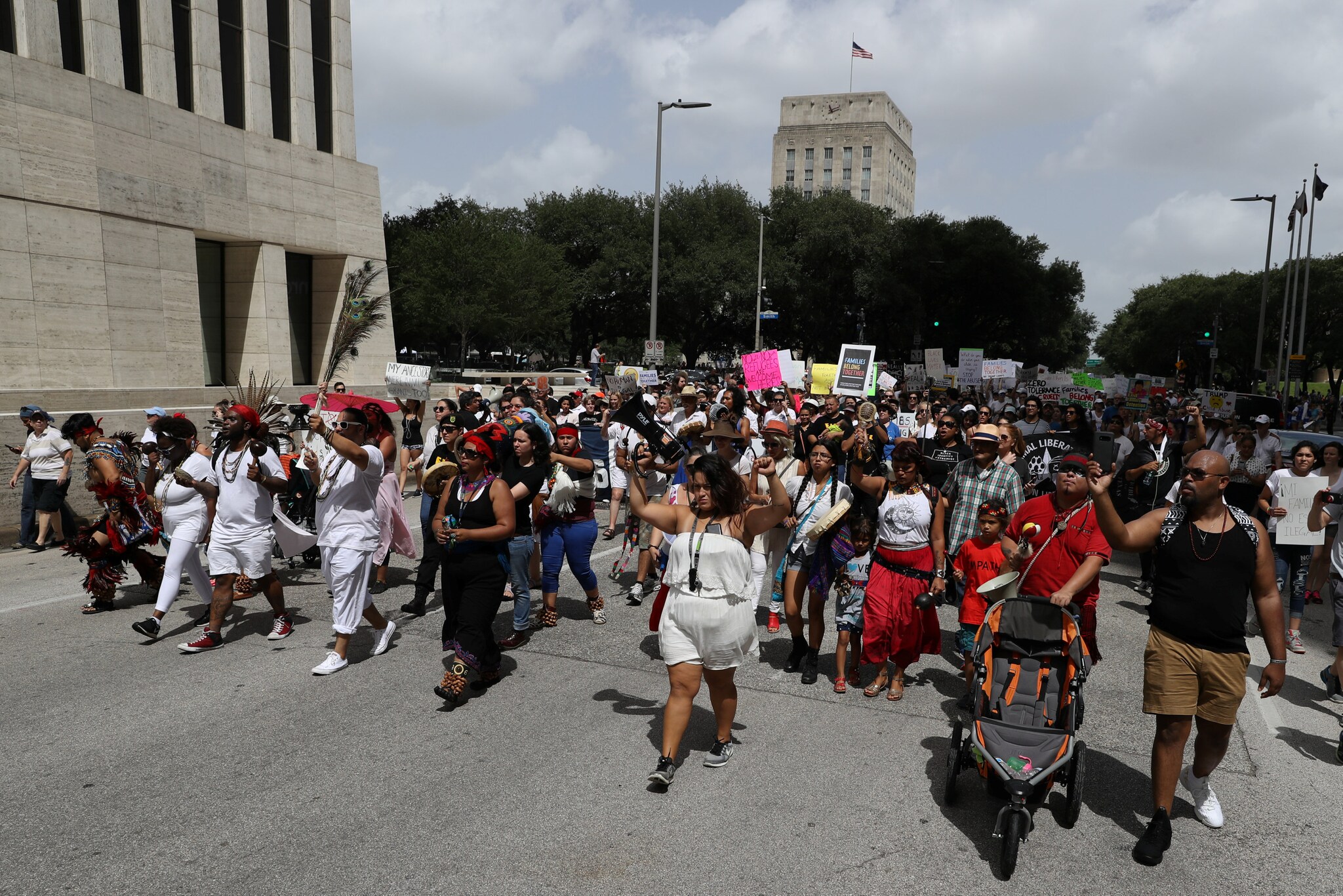 Demonstrators protest the Trump administration's immigration policies as part of a "Families Belong Together" rally in Houston, Texas, U.S., June 30, 2018. REUTERS/Loren Elliott