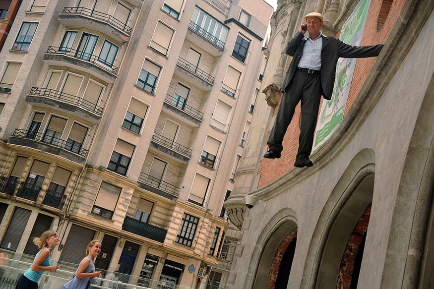 German street artist Johan Lorbeer is observed while performing