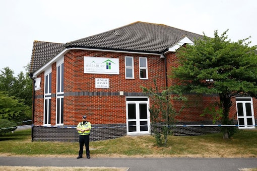 A police officer stands in front of Amesbury Baptist Church, which has been cordoned off after two people were hospitalised and police declared a 'major incident', in Amesbury.(Image: Reuters)