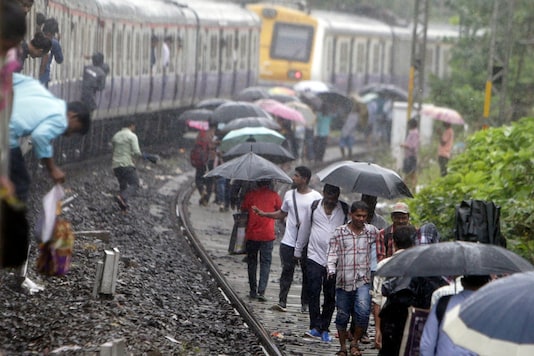 Mumbai Rains Around 2 000 Passengers Stranded In Two Trains Rescued