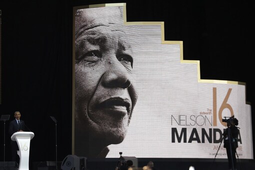Former U.S. President Barack Obama, left, delivers his speech at the 16th Annual Nelson Mandela Lecture at the Wanderers Stadium in Johannesburg, South Africa, Tuesday, July 17, 2018. (AP photo) Former U.S. President Barack Obama, left, delivers his speech at the 16th Annual Nelson Mandela Lecture at the Wanderers Stadium in Johannesburg, South Africa, Tuesday, July 17, 2018. (AP photo)