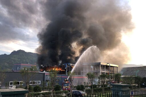 Rescue workers try to put out a fire after an explosion at a chemical plant inside an industrial park in Yibin, Sichuan province, China. (Photo:  China Daily via REUTERS)