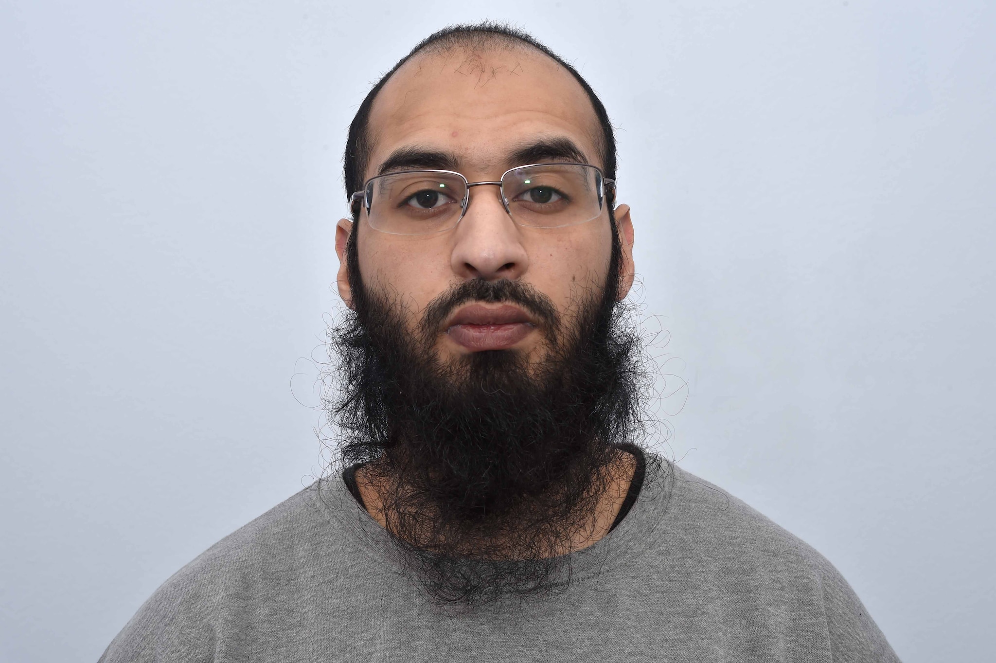 Husnain Rashid, who has pleaded guilty to terrorism offences relating to Britain's Prince George, is seen in this undated photograph issued by the Greater Manchester Police in Manchester