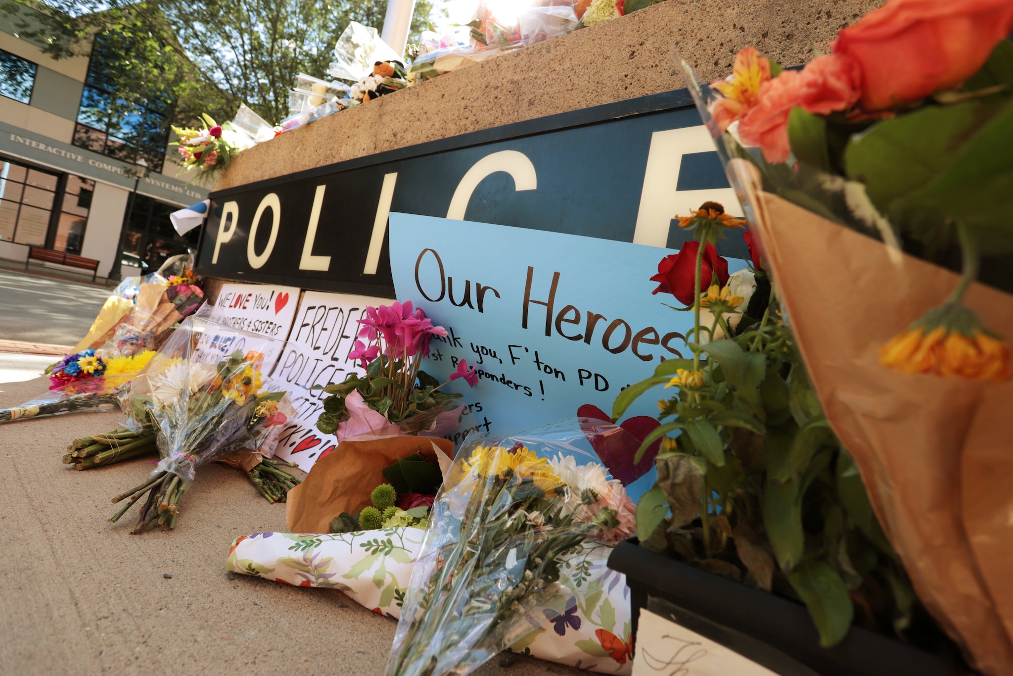 A makeshift memorial has been forming outside Fredericton Police Headquarters in Fredericton, New Brunswick, Canada, August 10, 2018. REUTERS/Dan Culberson