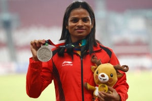 Women's 200m silver medalist India's Dutee Chand stands on the podium during the athletics competition at the 18th Asian Games in Jakarta, Indonesia. (Image: AP)