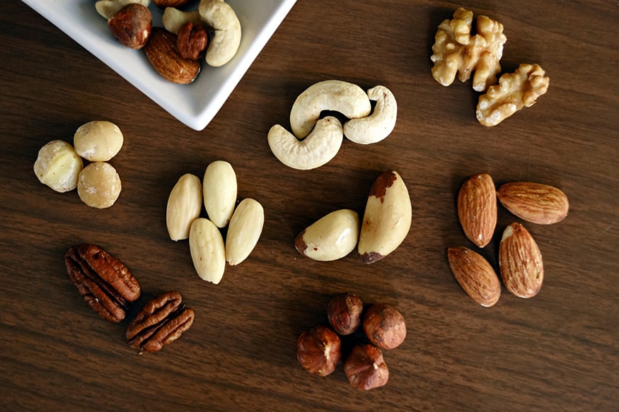 Nuts: Nuts provide micronutrients like selenium along with monounsaturated fats (MUFA) which in turn reduce the life-threatening risk of heart diseases. Almonds, hazelnuts, walnuts, cashews, pecans, pistachios should be included in your healthy snacking module. You can add them to your morning oatmeal or evening whole-wheat brownies too.