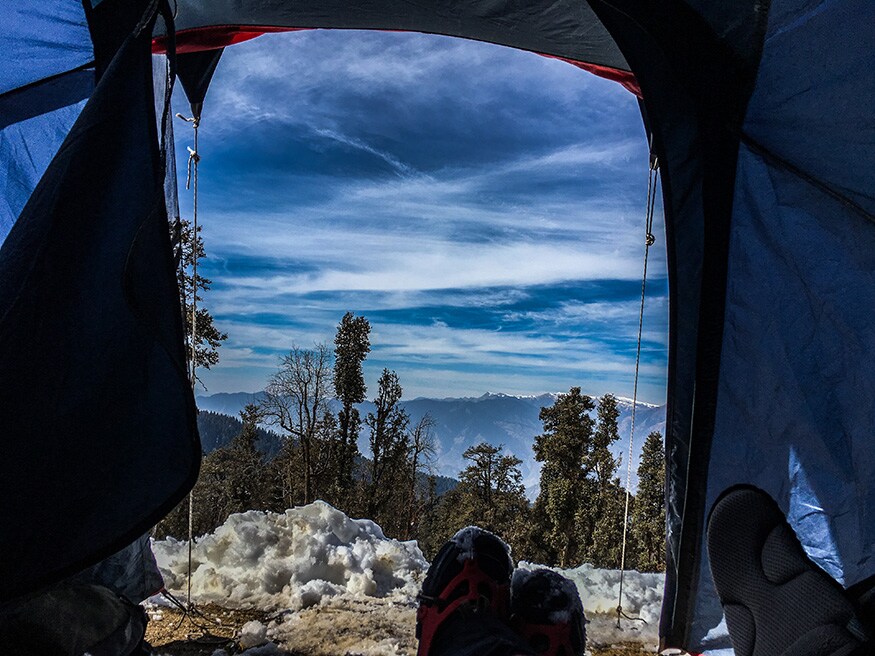 Resting inside the tent with a lovely view of the Himalayas comprising of Bandarpoonch, Swargarohini, Kala Nag and Ranglana. (Image: Sneha Mitra)