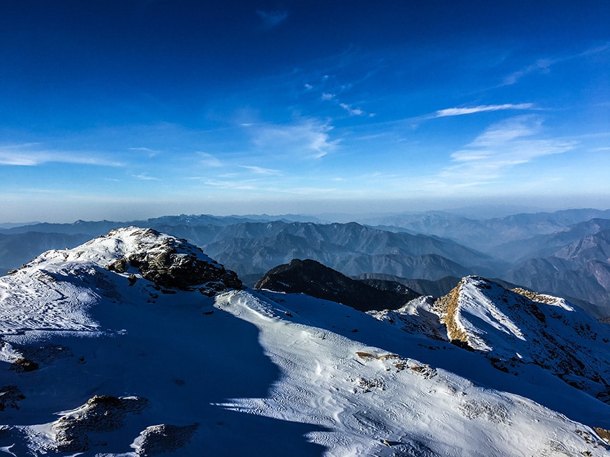Soaking in the sun and the living the most mesmerizing moment at the Kedarkantha Summit. (Image: Sneha Mitra)