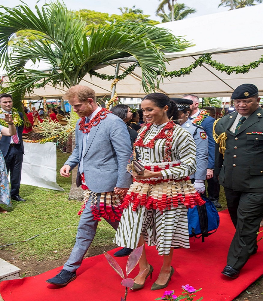 Britain's Prince Harry and Meghan, Duchess of Sussex wear a ta'ovala, a traditional Tongan dress wrapped around the waist, at the Fa'onelua Convention Centre in Nuku'alofa, Tonga, Friday, Oct. 26, 2018. Prince Harry and his wife Meghan are on day 11 of their 16-day tour of Australia and the South Pacific. (Dominic Lipinski/Pool Photo via AP)