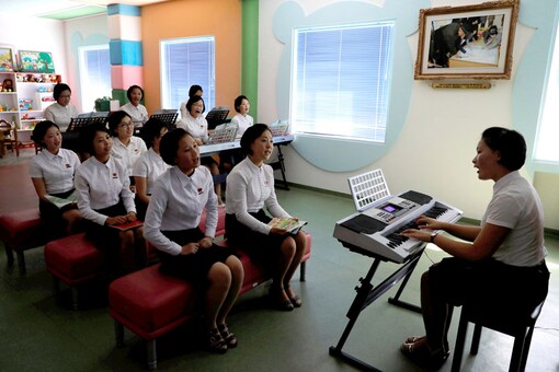 Students sing during a class at a teachers' training college, during a government-organized visit for foreign reporters in Pyongyang. (Image: Reuters)